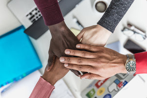 Multi-heritage hands together depicting equality, inclusion and diversity