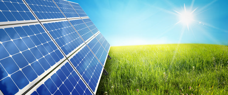 Solar panel situated in a green field